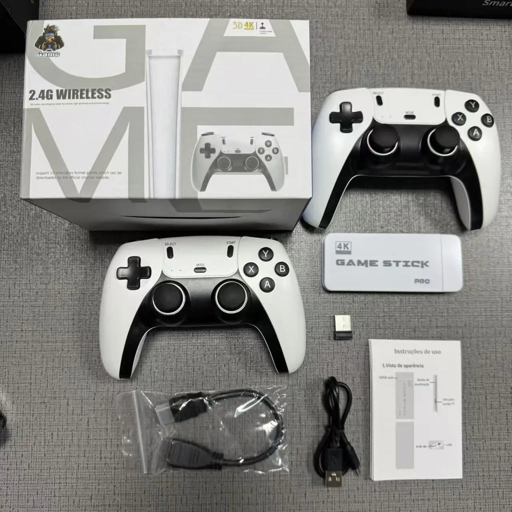 Gaming console with controllers and accessories on a gray surface
