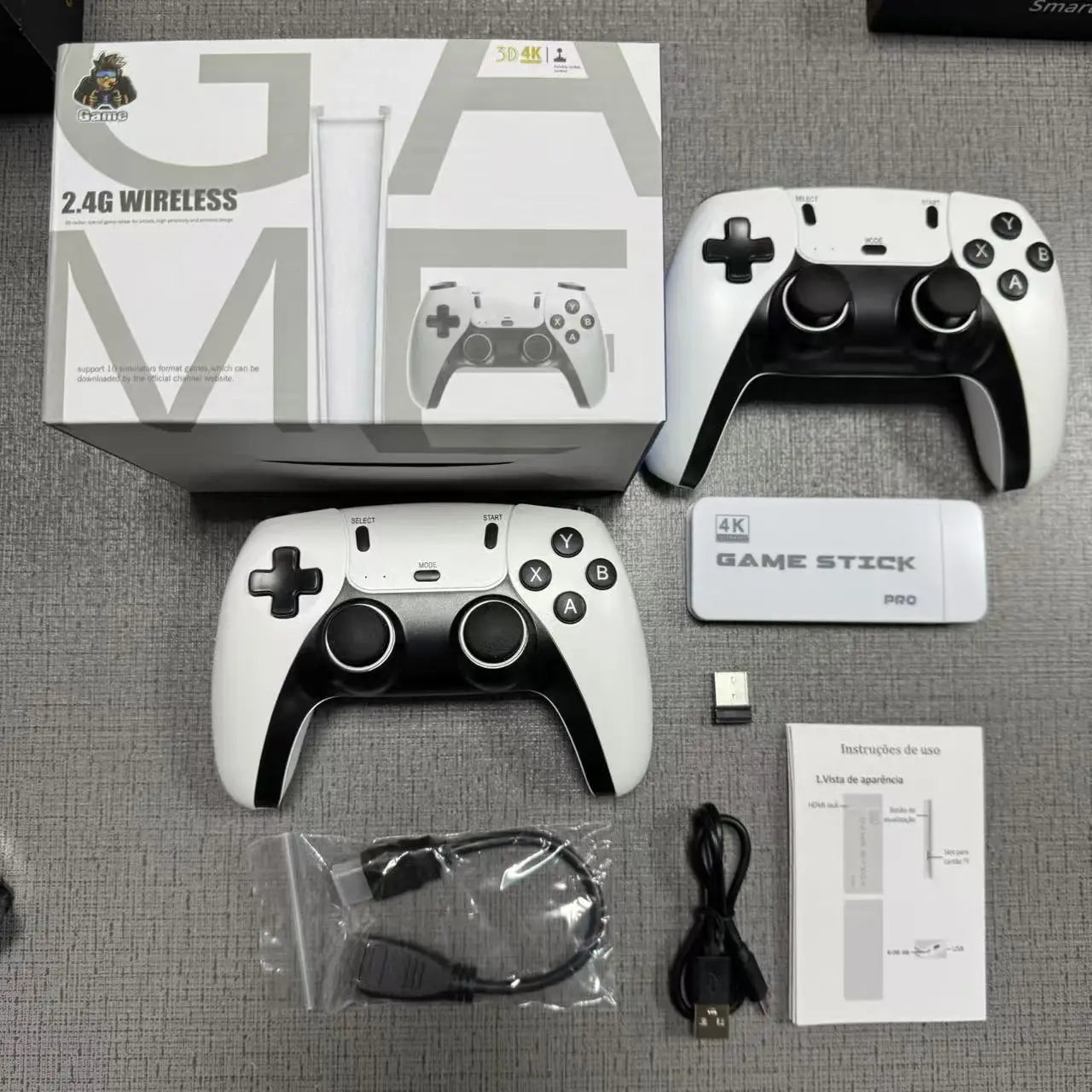Gaming console with controllers and accessories on a gray surface